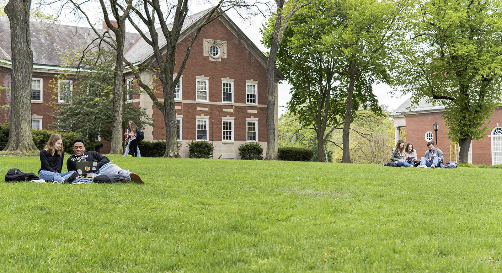 Photo of Shadyside Campus, with students studying together on the grass